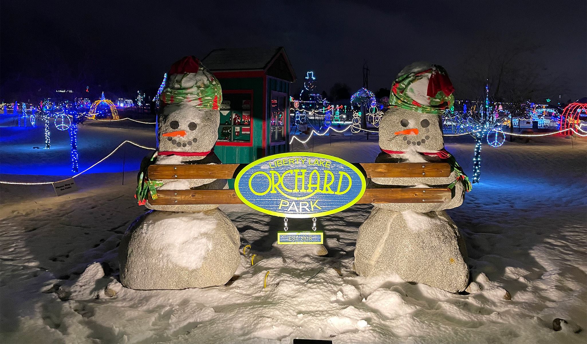 Winter Glow 2022 Orchard Park sign snowmen and lights