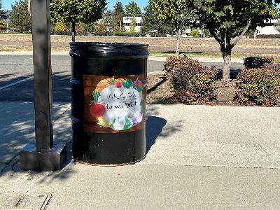 Image of 50 gal metal can with Farmer's Market art painted on it.